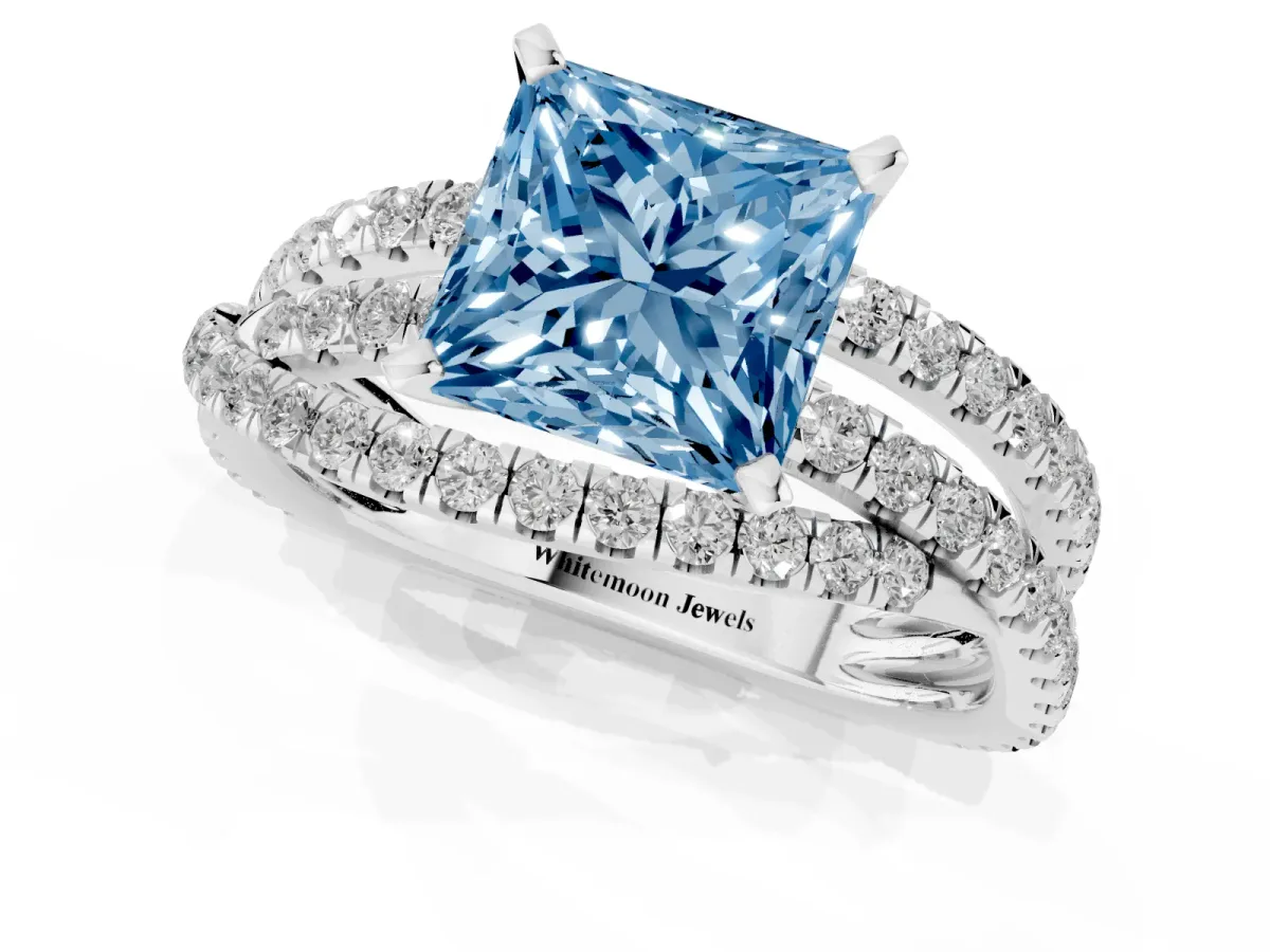 Fancy Blue Princess Cut Solitaire Twist Band with Pavé Setting and Four-Prong Setting Silver