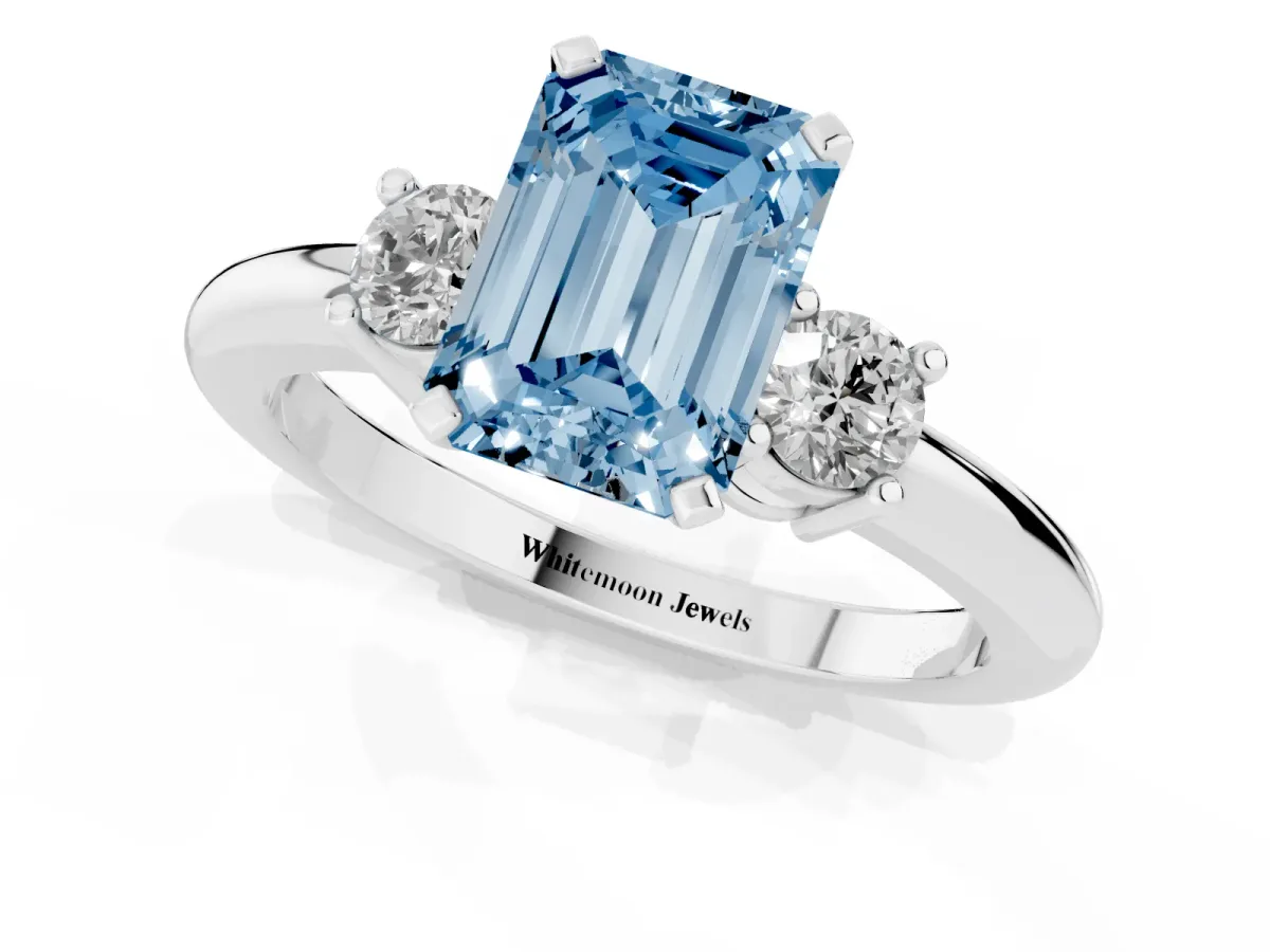 Fancy Blue Three-Stone Emerald Cut Cut Diamond Solitaire with Prong Setting and Classic Band Silver