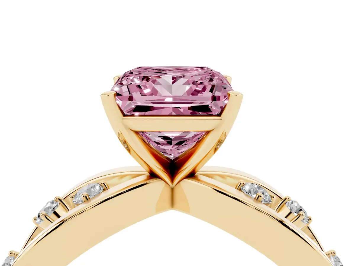 Fancy Pink Princess Cut Cut Solitaire Diamond with Side Stones on Criss-Cross Band and Four-Prong Setting Yellow gold