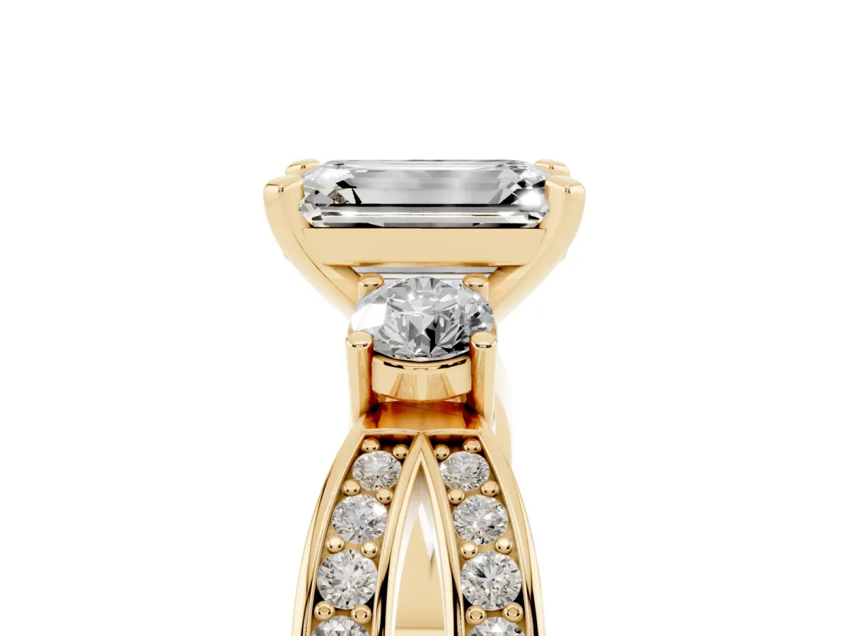 Three-Stone Emerald Cut Cut Diamond Twist Band with Prong Setting Yellow gold