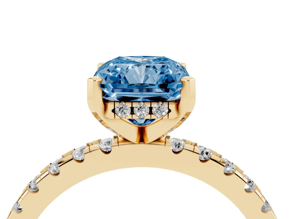 Fancy Blue Radiant Cut Diamond Solitaire Ring with Round Pavé Band and Four-Prong Setting Yellow gold