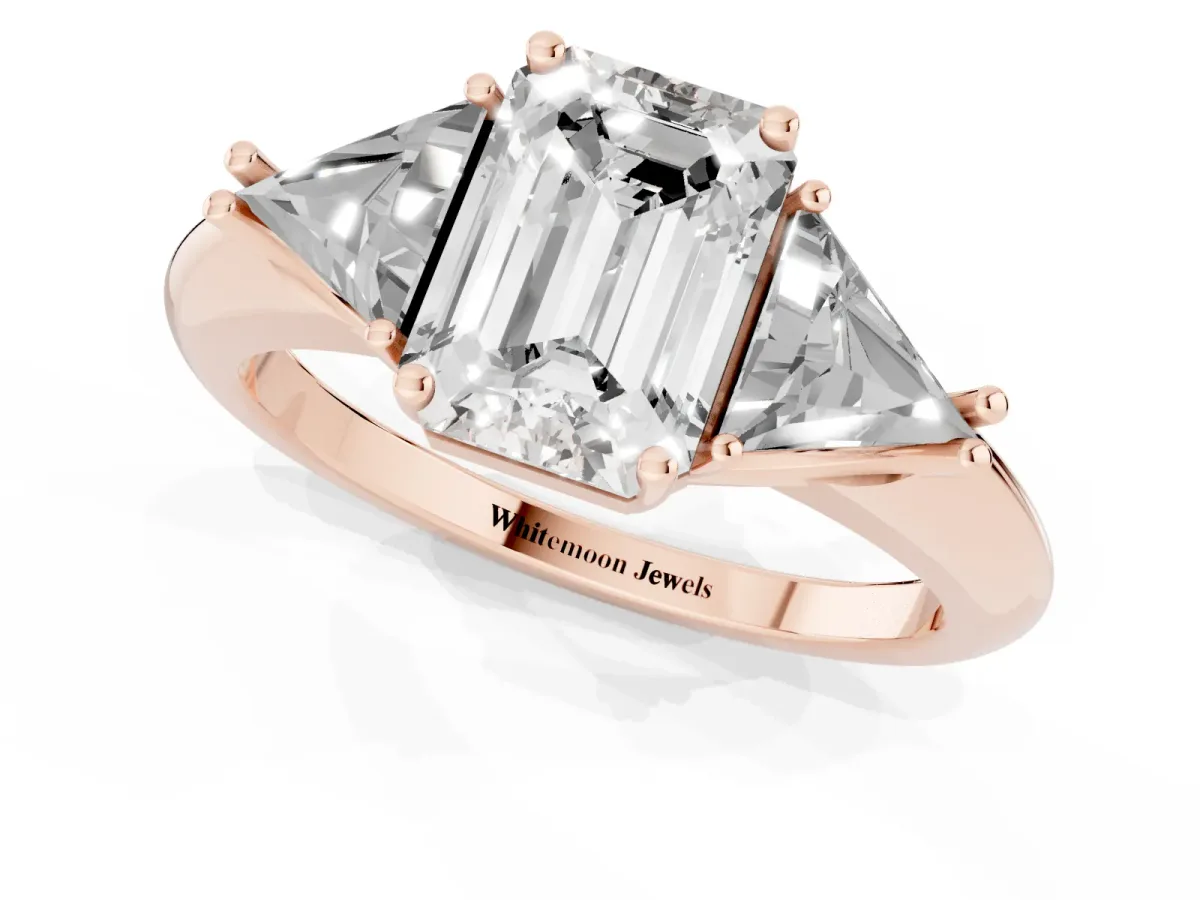 Three-Stone Emerald Cut Diamond Engagement Ring with Trillion Side Stones and Prong Setting Rose gold