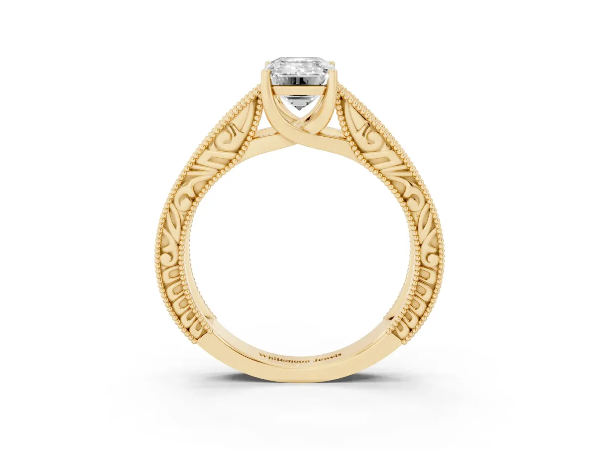 Emerald Cut Diamond Solitaire Ring with Engraved Band and Four-Prong Setting Yellow gold