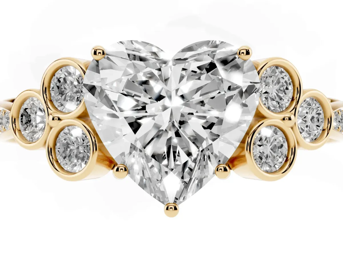 Heart Cut Cut Diamond Engagement Ring with Bezel Set Round Side Stones and Prong Setting Yellow gold
