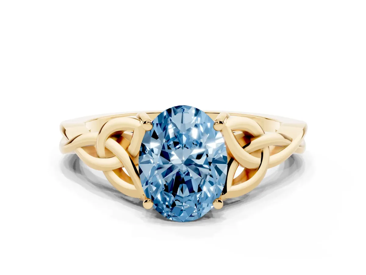 Fancy Blue Oval Cut Diamond Solitaire Engagement Ring with Celtic Knot Band and Four-Prong Setting Yellow gold