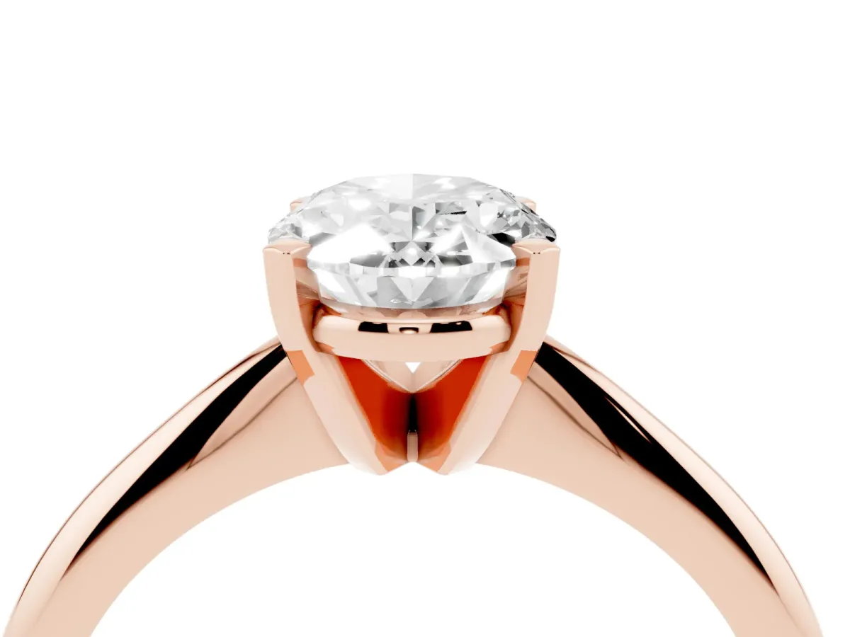 Oval Cut Cut Solitaire Ring with Four-Prong Setting on a Classic Band Rose gold