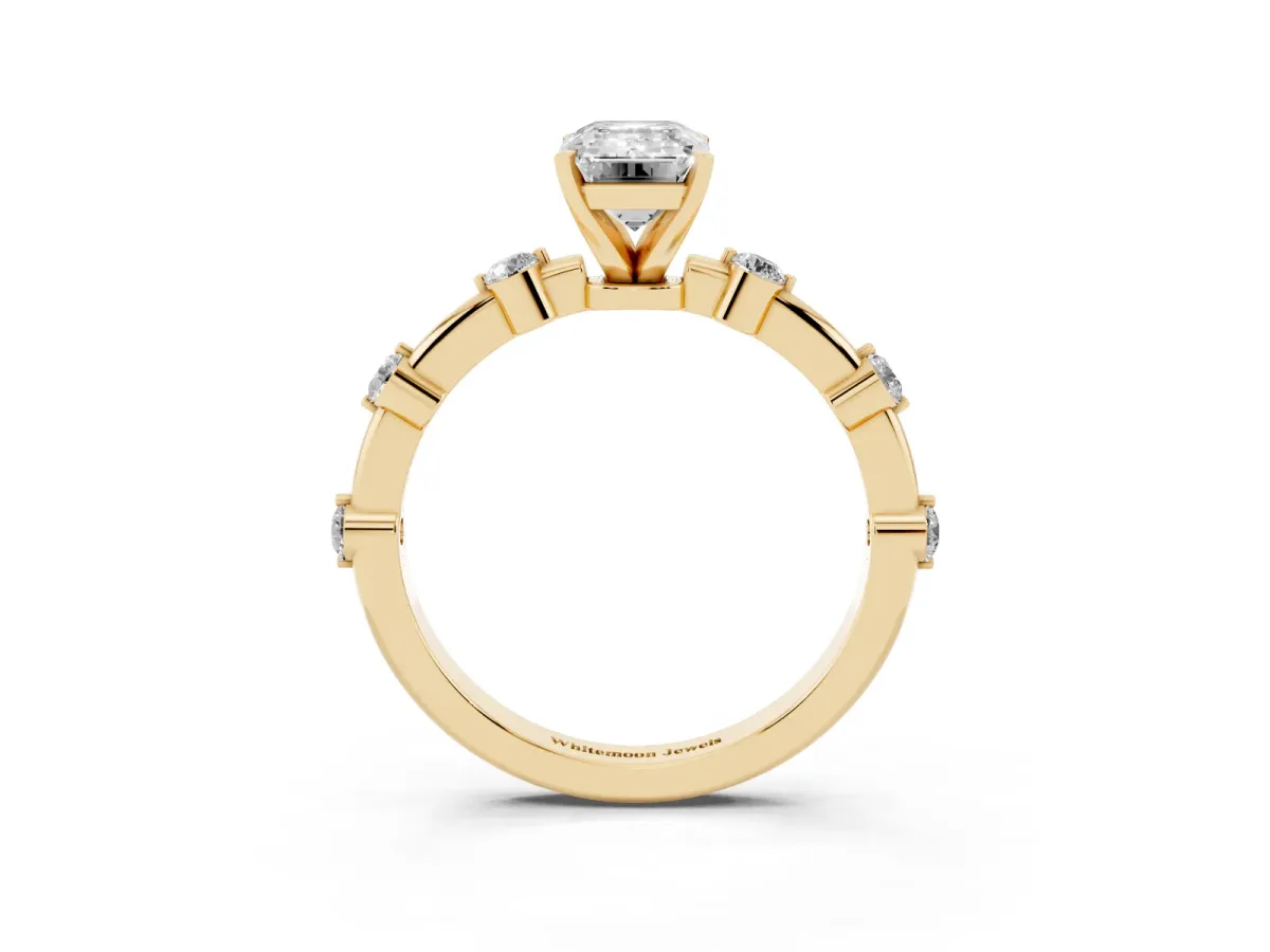 Emerald Cut Solitaire Diamond Ring with Bezel Set Side Stones and Prong Setting Yellow gold
