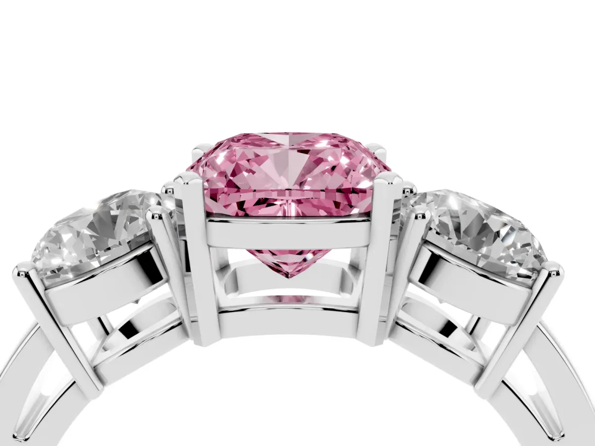 Fancy Pink Three-Stone Cushion Cut Diamond Ring with Round Side Stones, Classic Band, and Four-Prong Setting White gold
