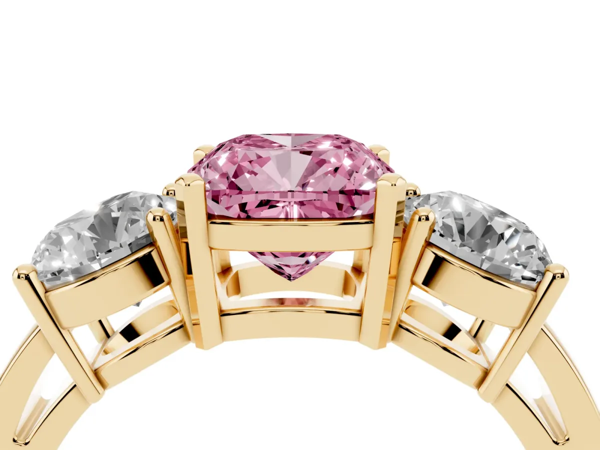 Fancy Pink Three-Stone Cushion Cut Diamond Ring with Round Side Stones, Classic Band, and Four-Prong Setting Yellow gold