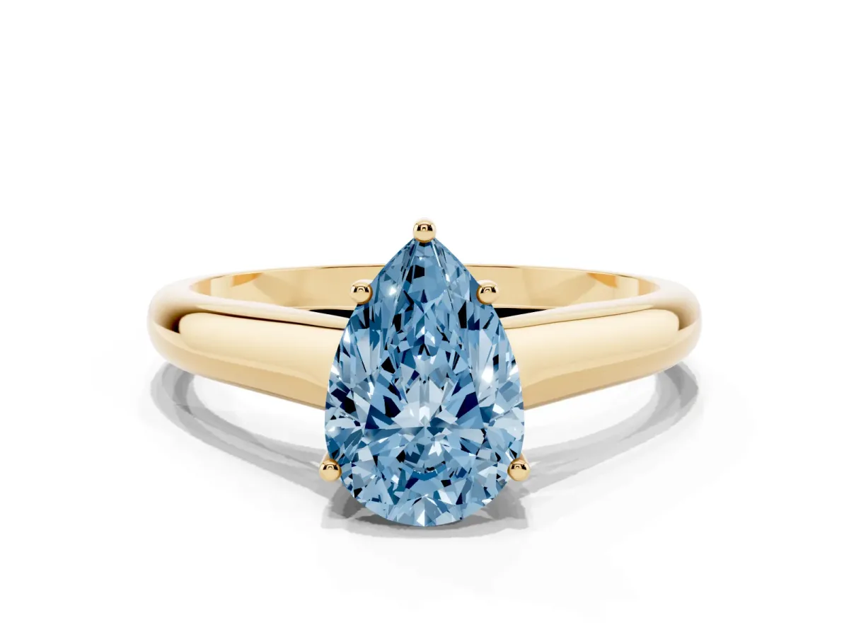 Fancy Blue Pear Cut Solitaire Engagement Ring with Tapered Band and Four-Prong Setting Yellow gold
