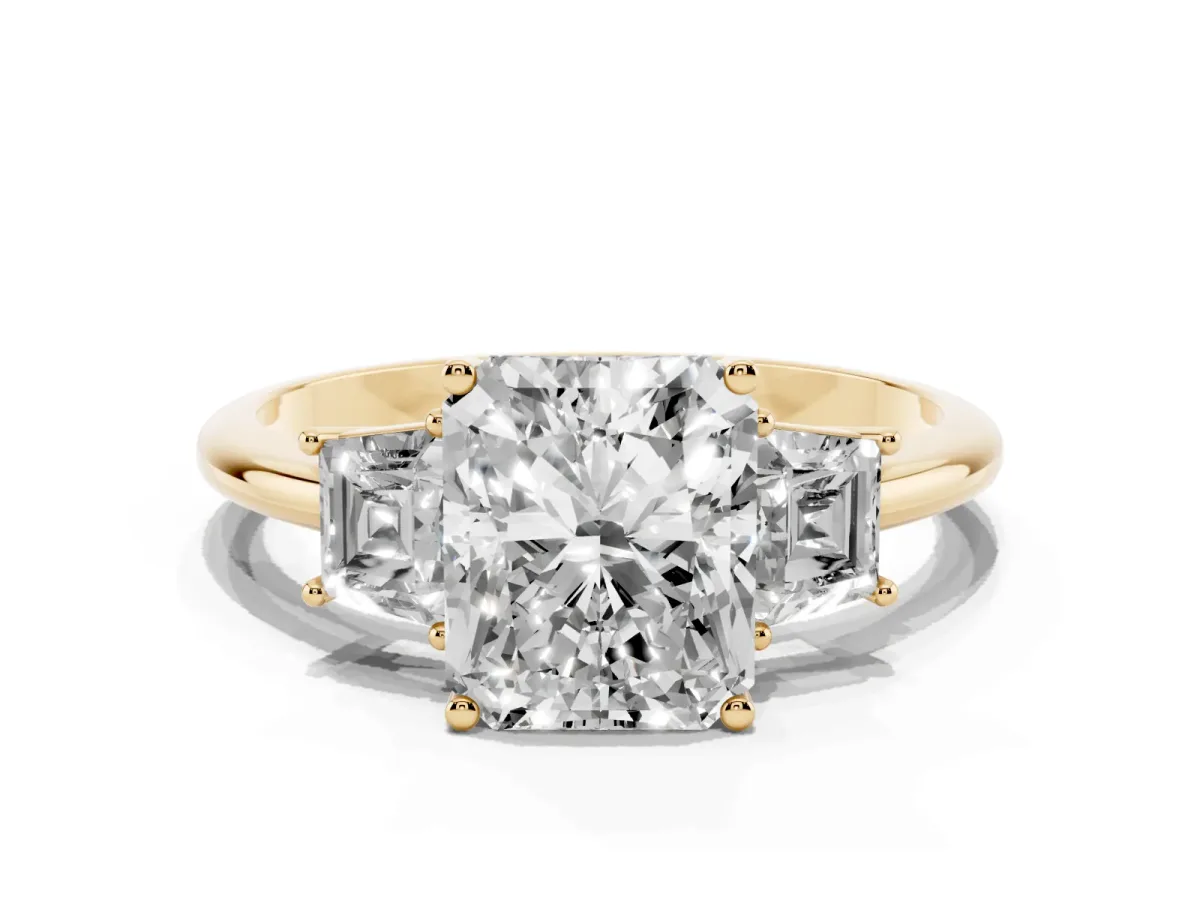 Radiant Cut Diamond Three-Stone Ring with Trapezoid Side Stones and Prong Setting Yellow gold