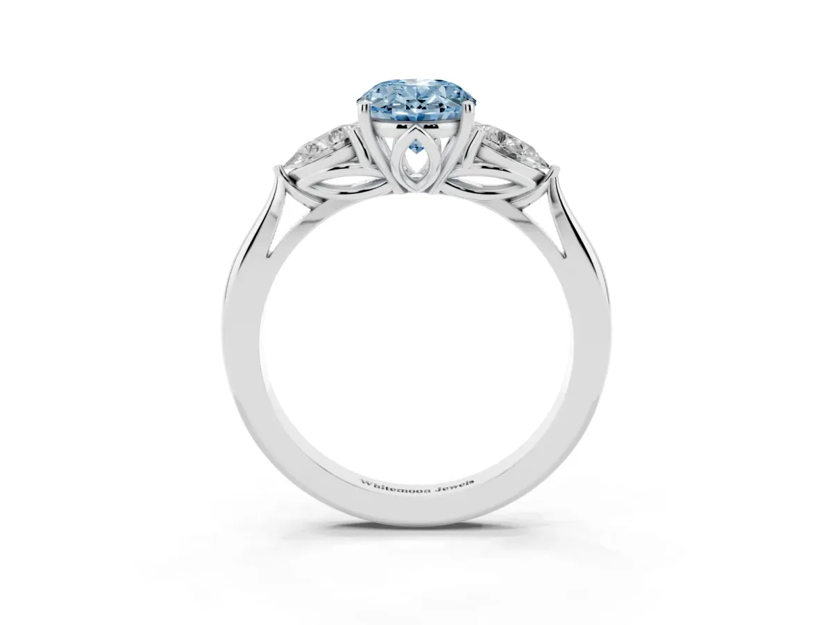 Fancy Blue Three-Stone Oval Cut Brilliant Diamond Solitaire Ring with Tapered Band and Four-Prong Setting Platinum
