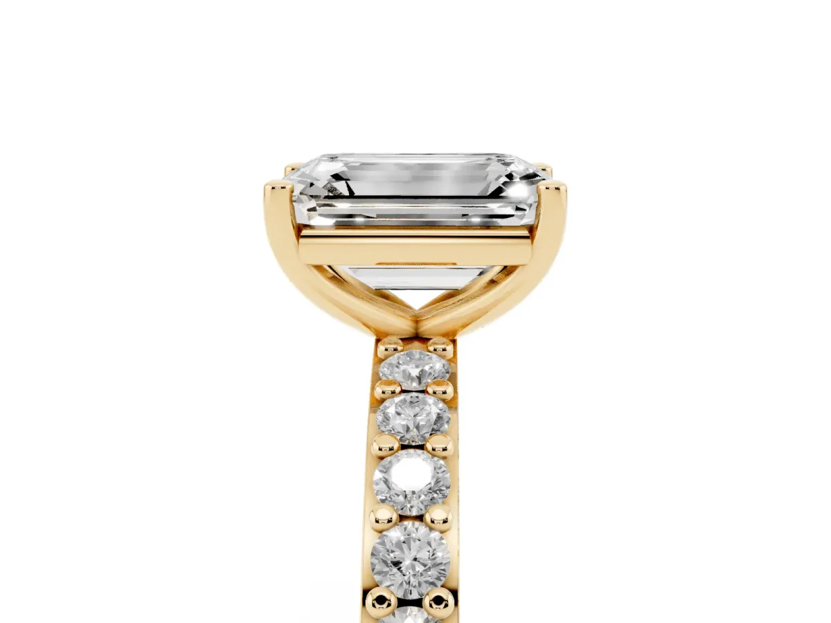 Emerald Cut Cut Diamond Solitaire with Pave Band and Four-Prong Setting Yellow gold