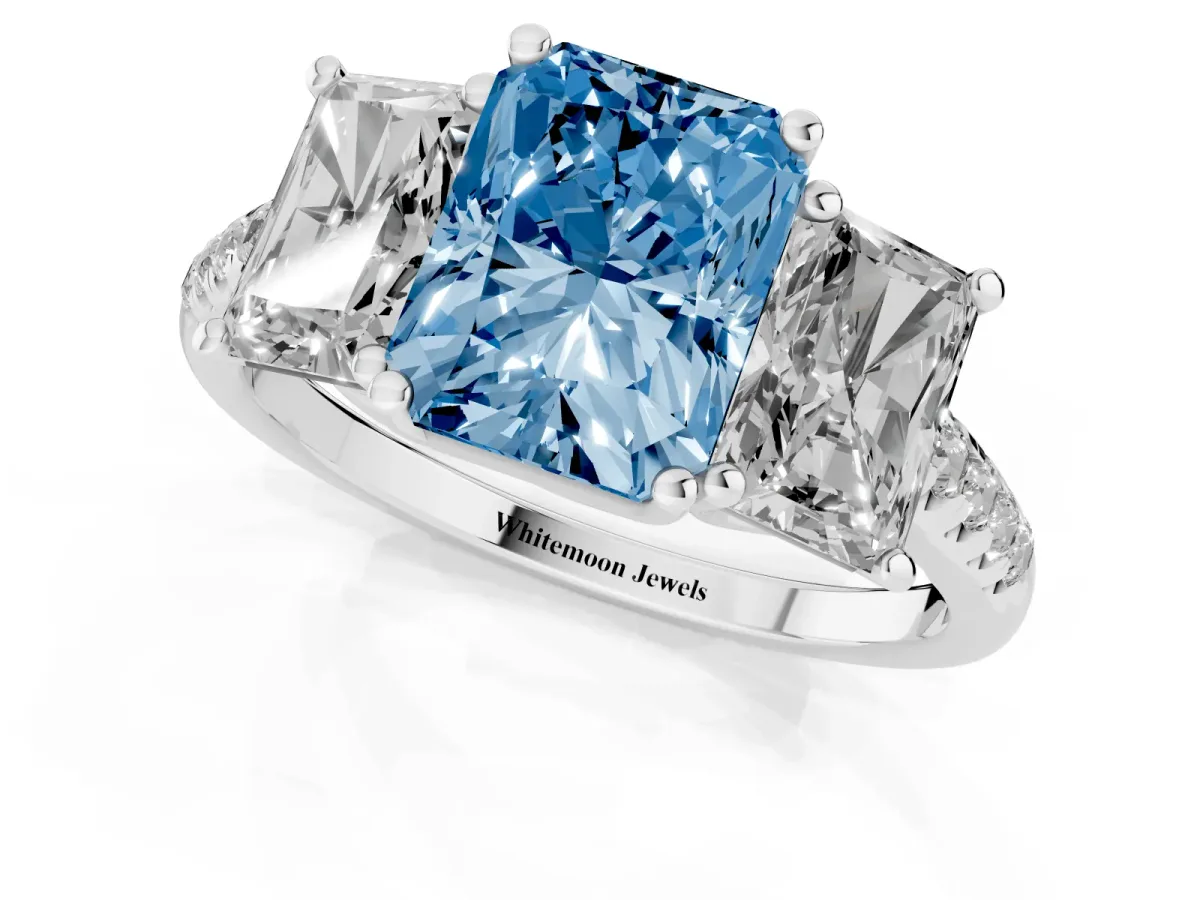 Fancy Blue Three-Stone Radiant Cut Diamond Ring with Round Pavé Band and Prong Setting Silver