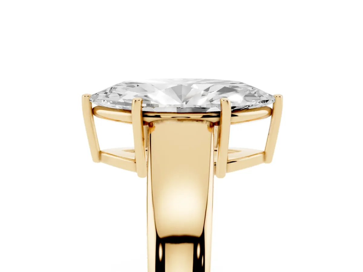 Marquise Cut Solitaire Diamond Ring with Tapered Band and Four-Prong Setting Yellow gold
