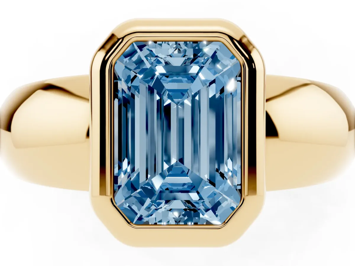 Fancy Blue Bezel Set Emerald Cut Solitaire Ring with Wide Band Yellow gold