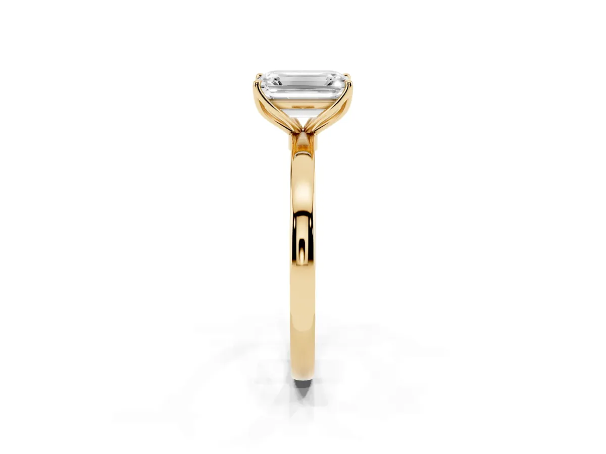 Emerald Cut Diamond Solitaire Ring with Thin Band and Prong Setting Yellow gold