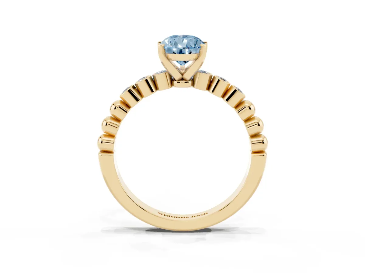 Fancy Blue Pear Cut Solitaire Bezel Accent Diamond Engagement Ring with Beaded Band and Four-Prong Setting Yellow gold
