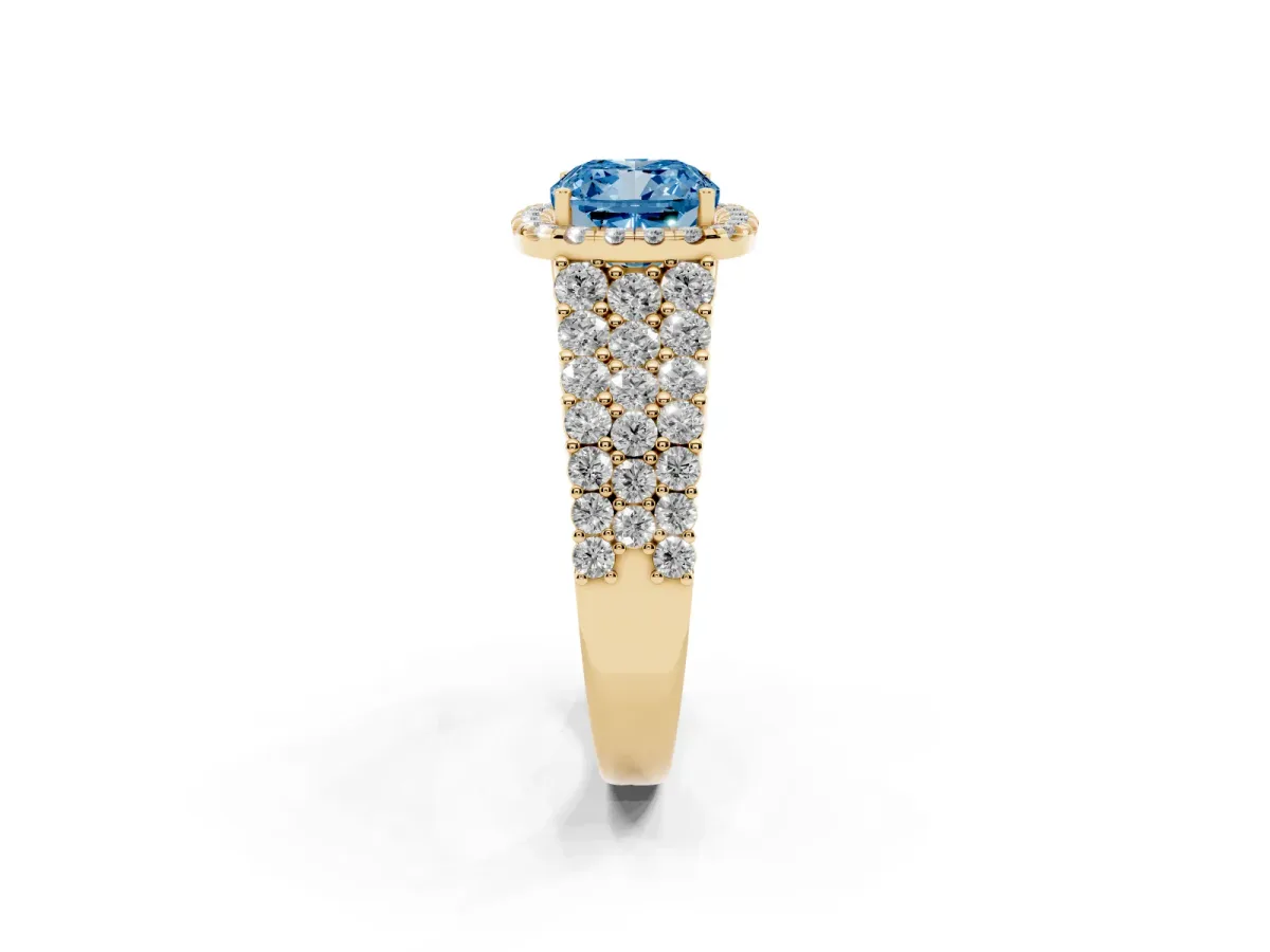 Fancy Blue Cushion Cut Diamond Halo Engagement Ring with Triple Row Round Pavé Band and Prong Setting Yellow gold