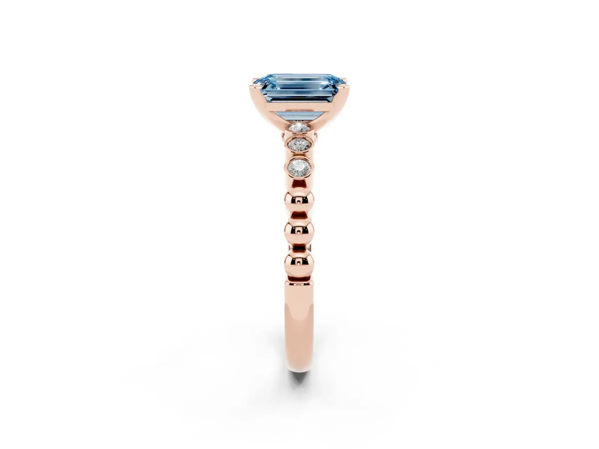 Fancy Blue Emerald Cut Solitaire Bezel Accent Diamond Engagement Ring with Beaded Band and Four-Prong Setting Rose gold
