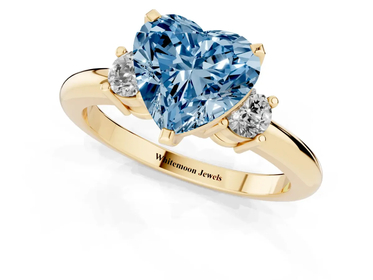 Fancy Blue Three-Stone Heart Cut Cut Diamond Solitaire with Prong Setting and Classic Band Yellow gold