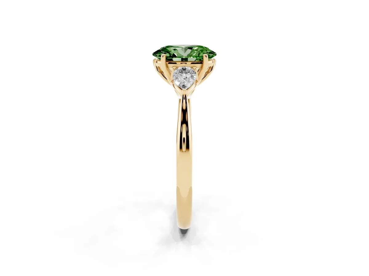 Fancy Green Three-Stone Oval Cut Diamond Ring with Pear Side Stones in Four-Prong Setting Yellow gold