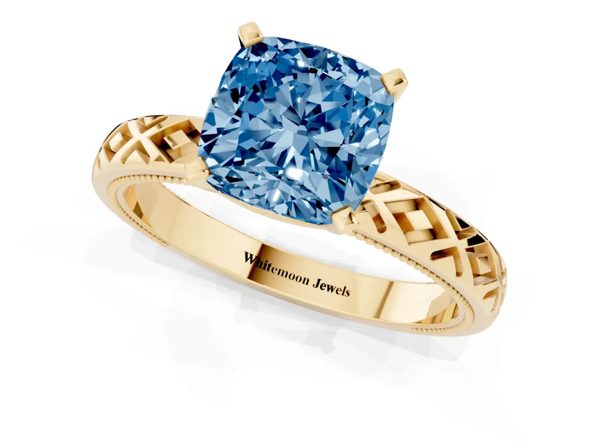 Fancy Blue Cushion Cut Solitaire Diamond Ring with Milgrain and Black Enamel X Pattern Band Yellow gold