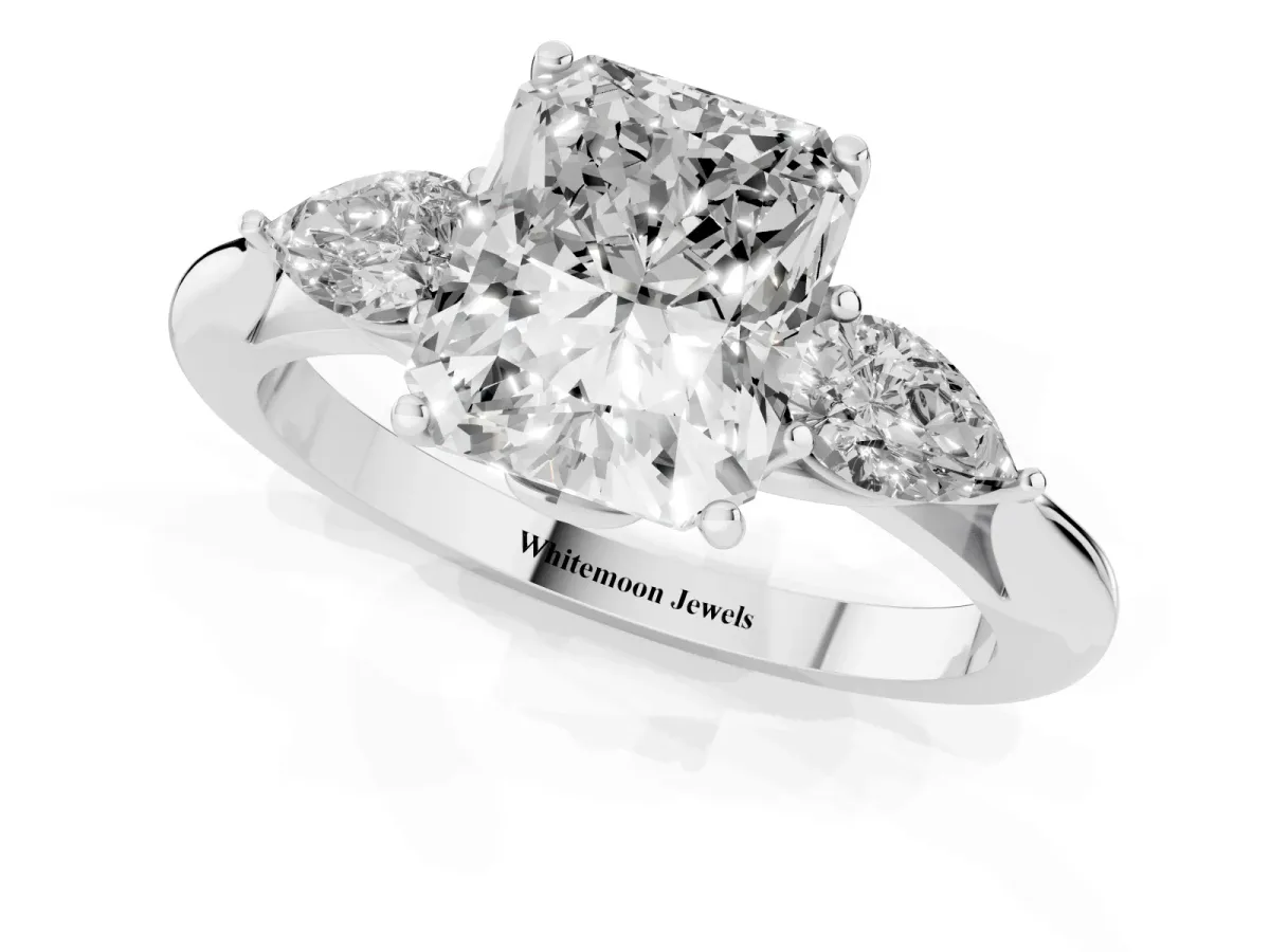 Radiant Cut Diamond Three-Stone Ring with Pear Side Stones and Prong Setting Platinum