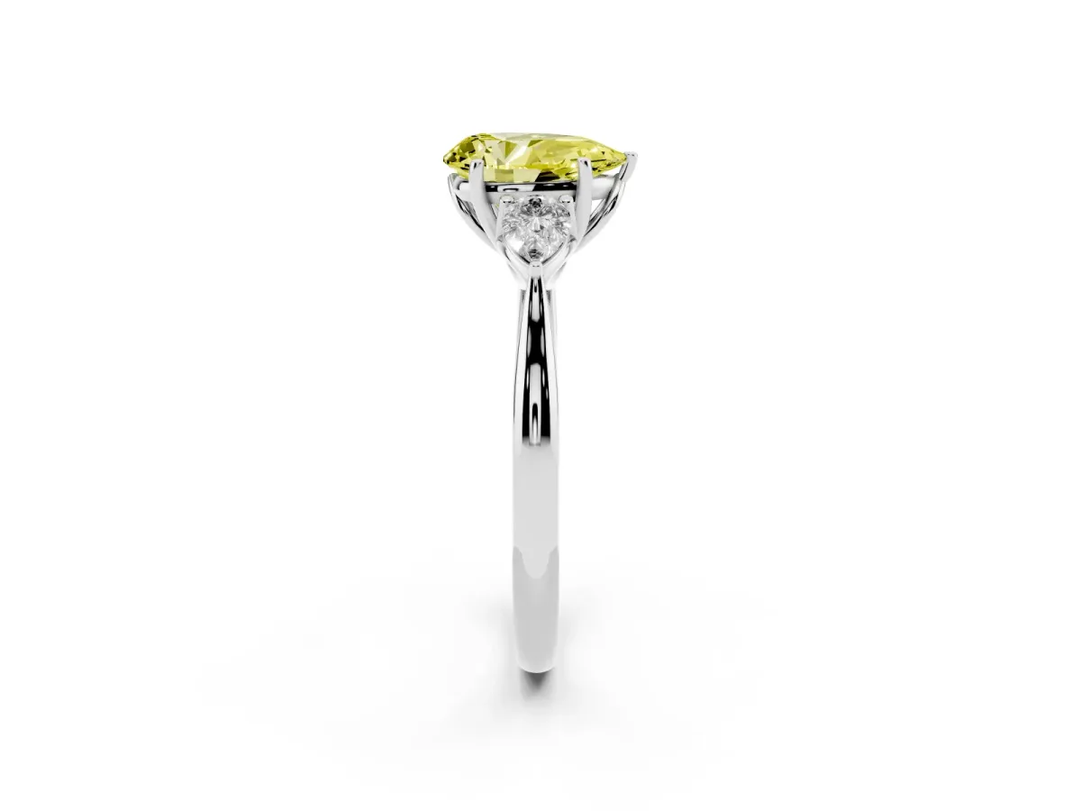 Fancy Yellow Three-Stone Pear Cut Diamond Ring with Pear Side Stones in Four-Prong Setting Platinum