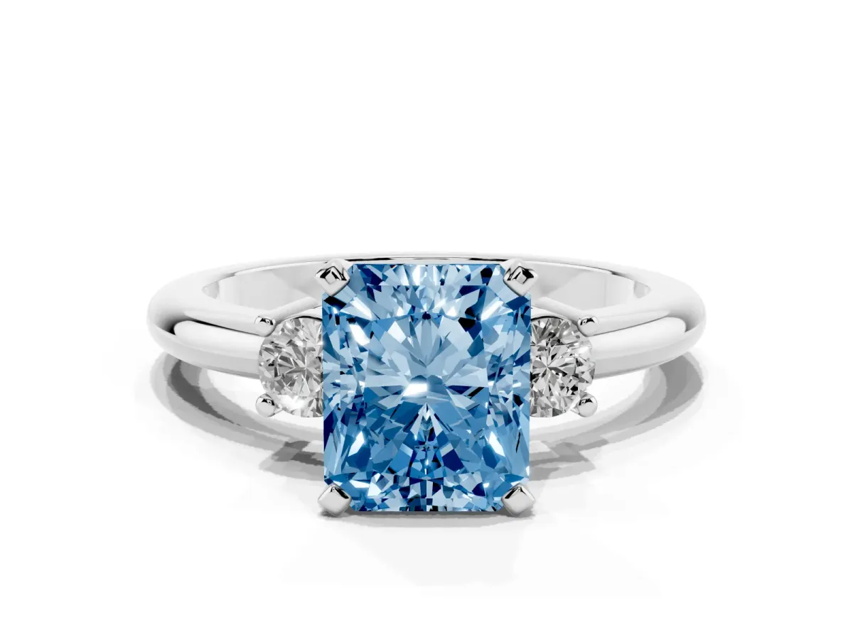 Fancy Blue Three-Stone Radiant Cut Cut Diamond Solitaire with Prong Setting and Classic Band Platinum