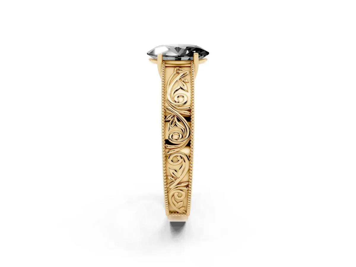 Fancy Black Oval Cut Diamond Solitaire Ring with Engraved Band and Four-Prong Setting Yellow gold