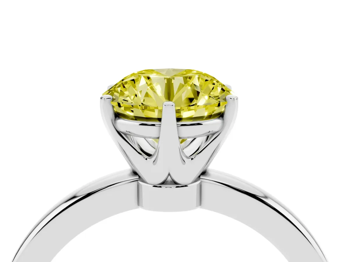 Fancy Yellow Round Cut Solitaire Diamond Ring with Six-Prong Setting on a Classic Band Silver