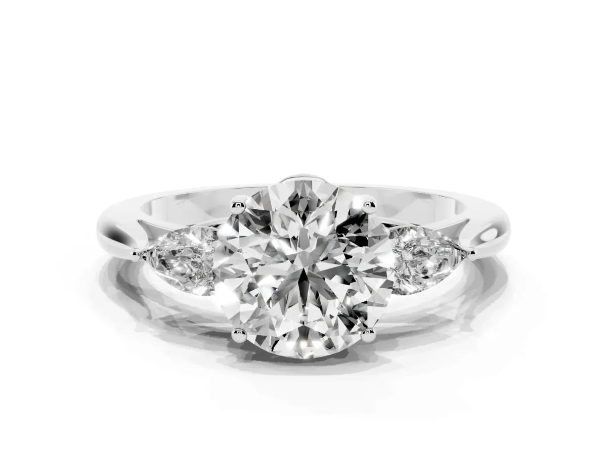 Round Cut Diamond Three-Stone Ring with Pear Side Stones and Prong Setting Platinum