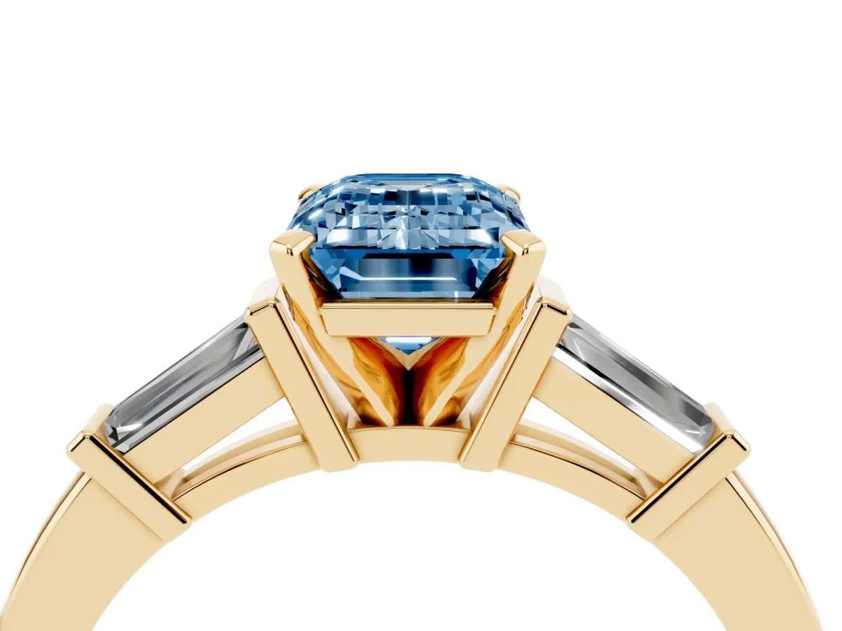 Fancy Blue Emerald Cut Cut Diamond Solitaire Ring with Tapered Baguette Accents and Four-Prong Setting Yellow gold