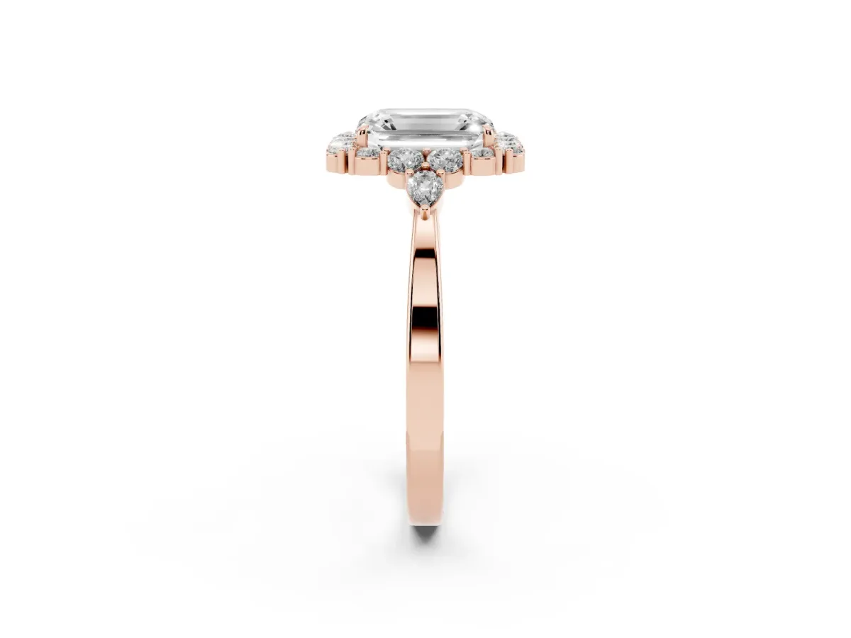 Emerald Cut Diamond Halo Ring with Pear Side Stones and Prong Setting Rose gold