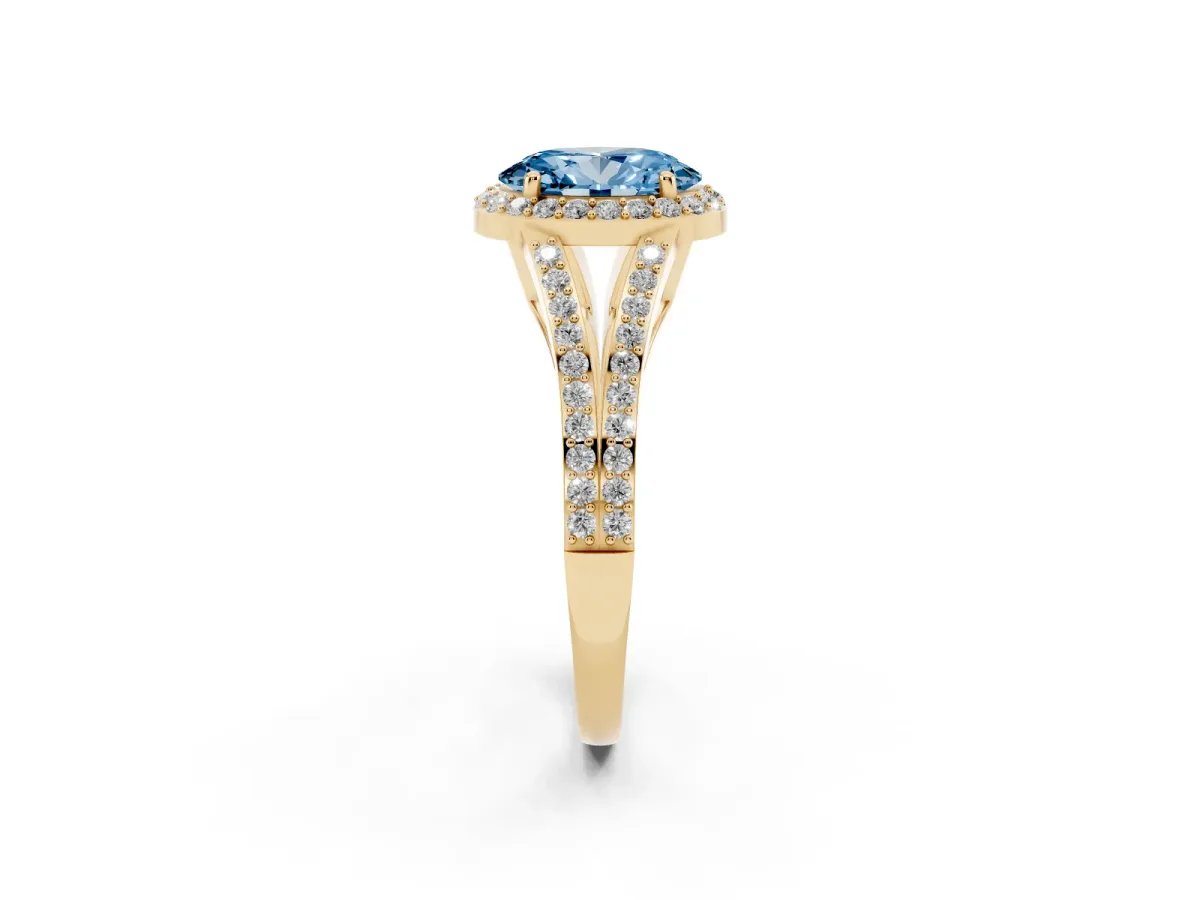 Fancy Blue Oval Cut Halo Split Shank Diamond Ring with Prong Setting Yellow gold