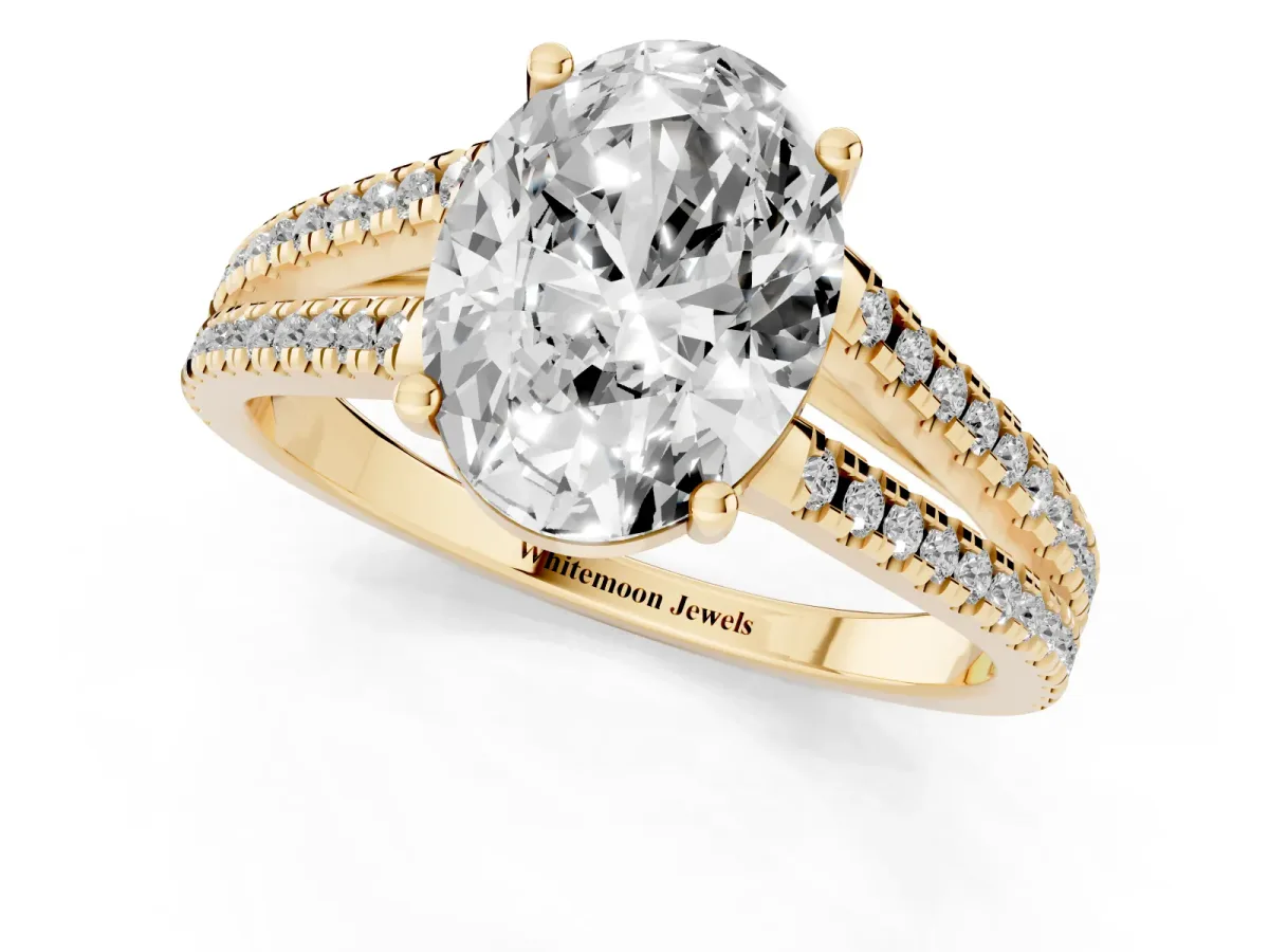 Oval Cut Diamond Solitaire Engagement Ring with Split Shank Pavé Band Yellow gold