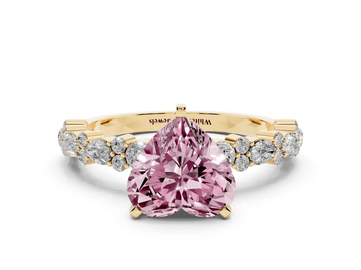 Fancy Pink Heart Cut Diamond Side Stone Solitaire Ring with Round and Four-Prong Setting Yellow gold
