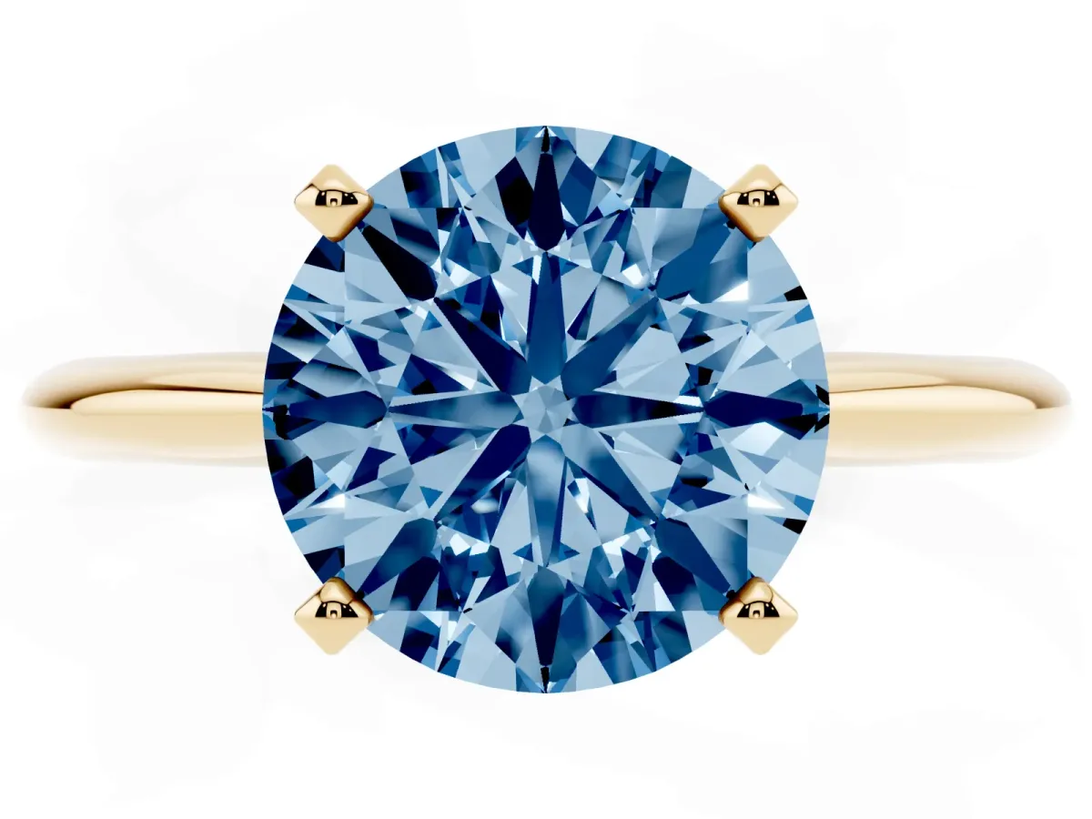 Fancy Blue Round Cut Cut Solitaire Ring with Four-Prong Setting on a Classic Band Yellow gold