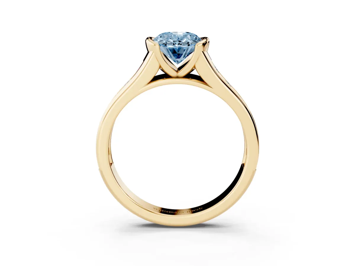 Fancy Blue Oval Cut Solitaire Bezel-Set Diamond Ring with Channel-Set Band Yellow gold