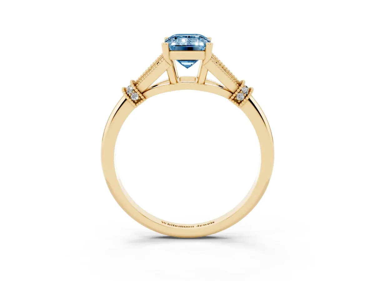 Fancy Blue Emerald Cut Diamond Solitaire Ring with Floral Filigree and Pave Accents Yellow gold