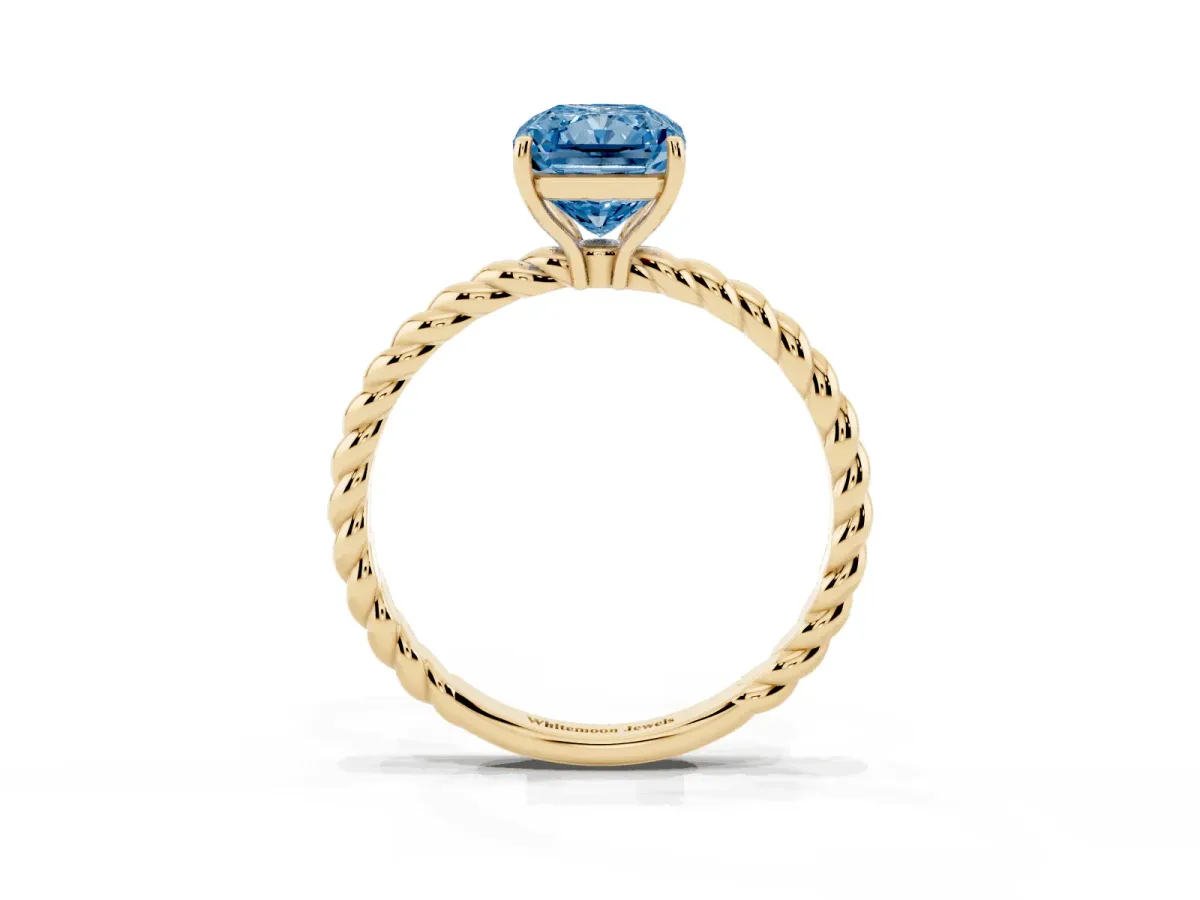 Fancy Blue Radiant Cut Solitaire Twist Band Ring with Four-Prong Setting Yellow gold
