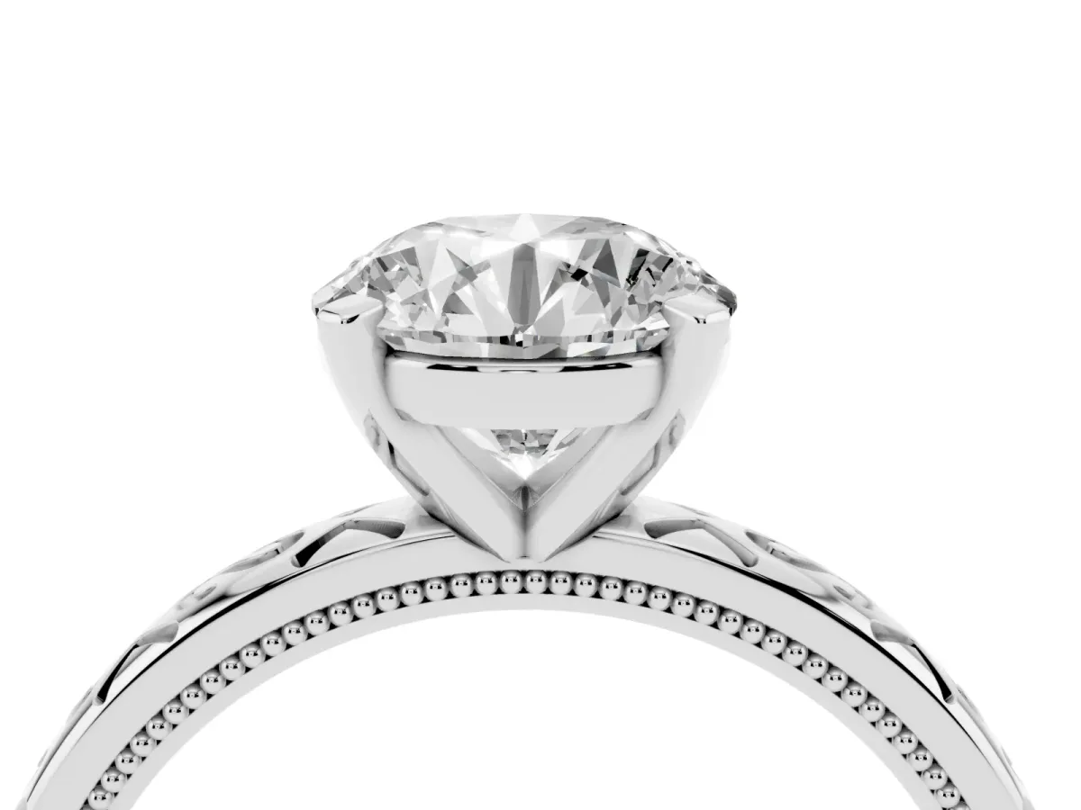 Round Cut Solitaire Engagement Ring with Scrollwork Band and Four-Prong Setting Silver