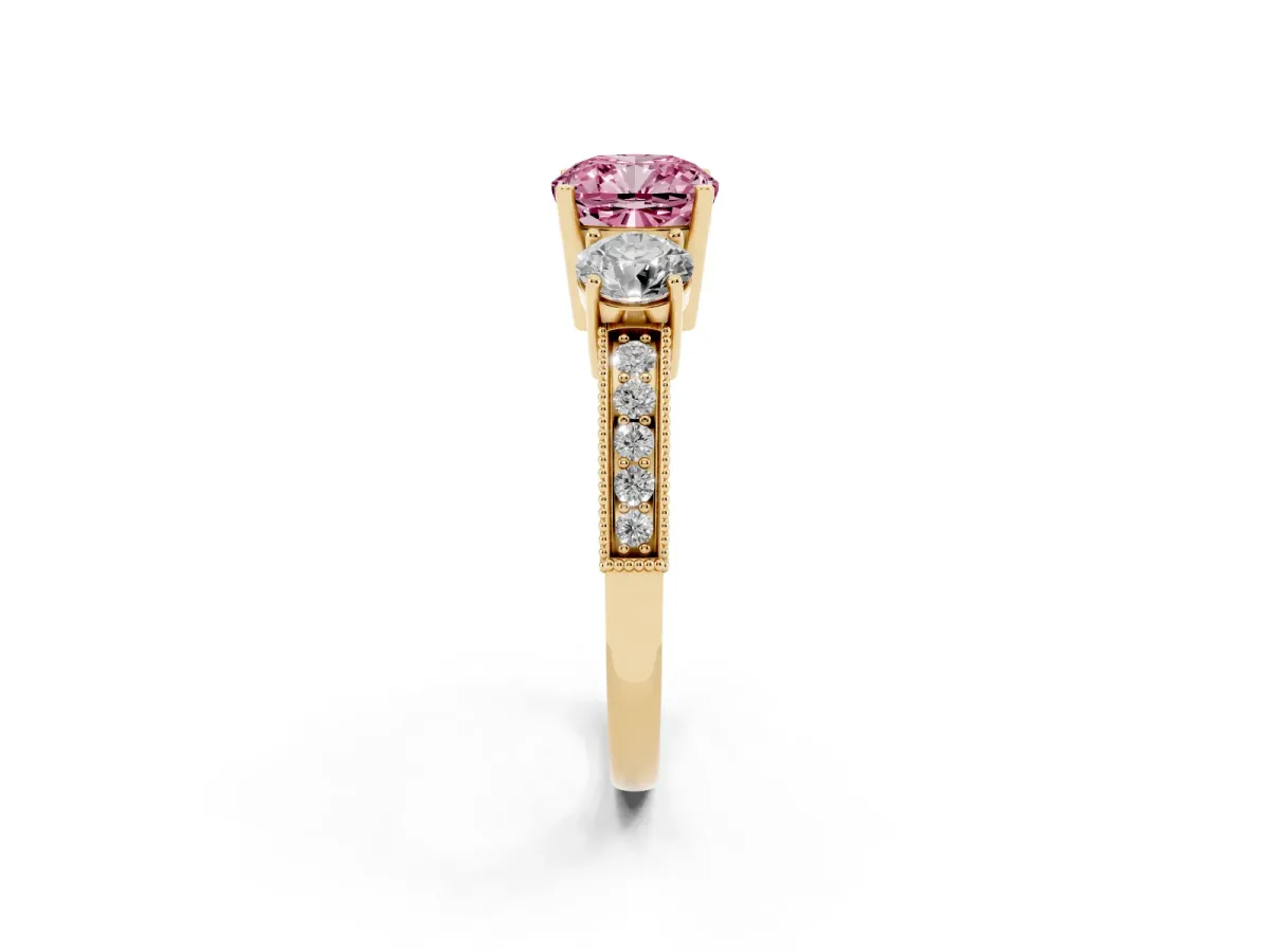 Fancy Pink Cushion Cut Three-Stone Diamond Ring with Pavé Band and Four-Prong Setting Yellow gold
