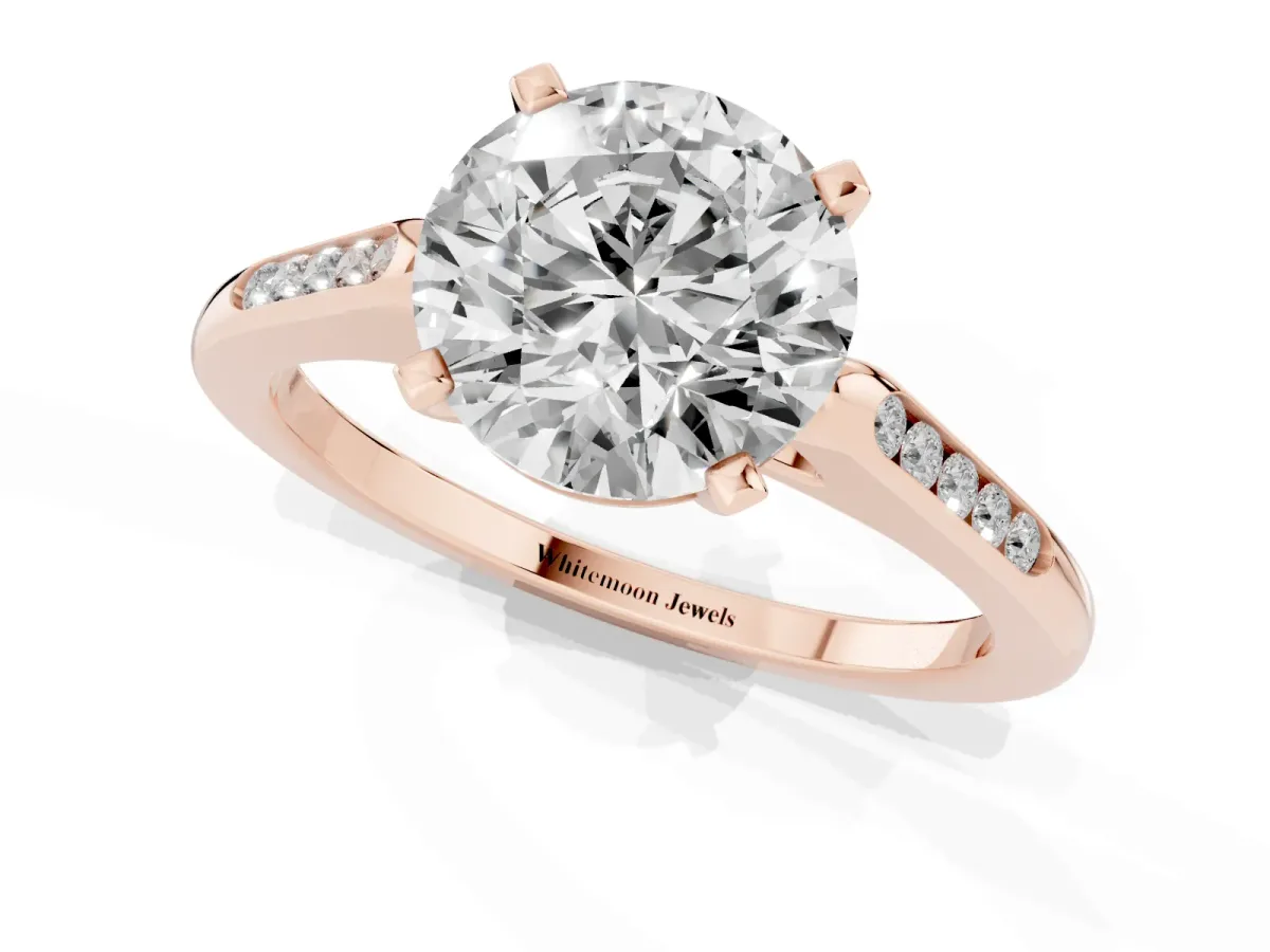 Round Cut Diamond Solitaire Ring with Channel Set Round Band and Prong Setting Rose gold