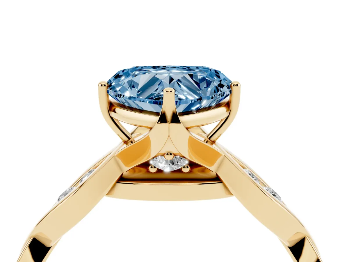 Fancy Blue Heart Cut Solitaire Twist Band with Leaf Prong Setting Yellow gold