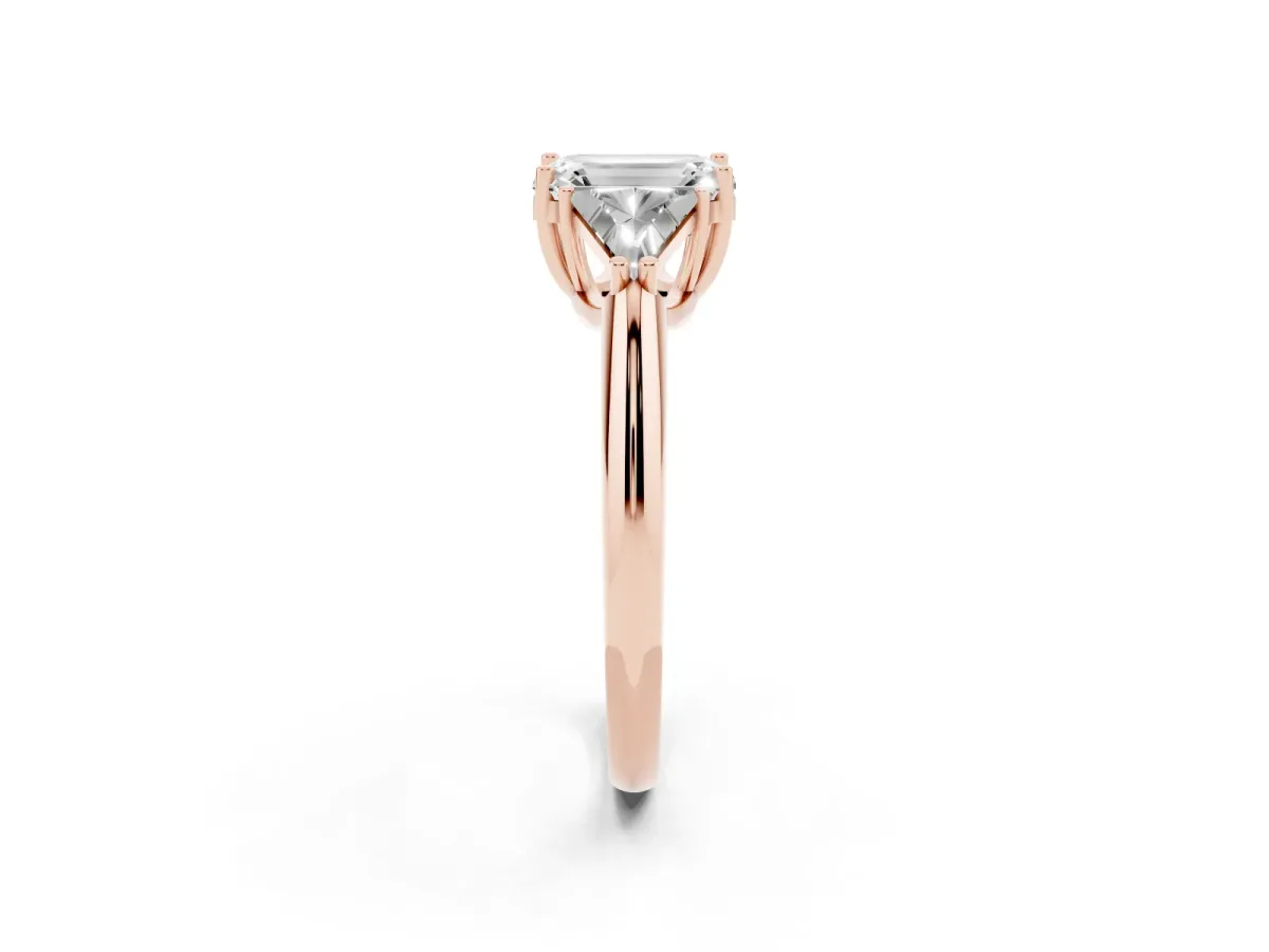 Three-Stone Emerald Cut Diamond Engagement Ring with Trillion Side Stones and Prong Setting Rose gold