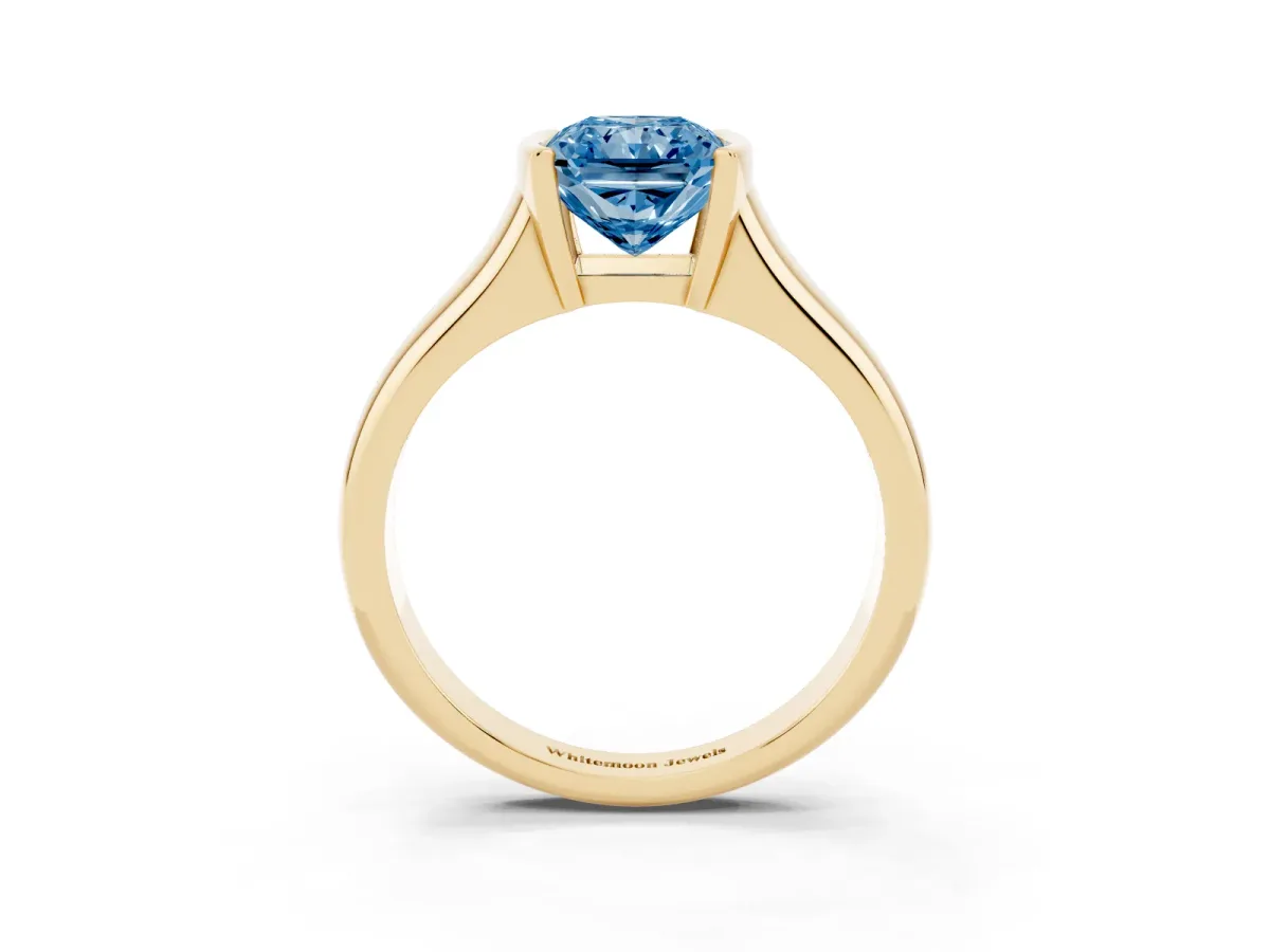 Fancy Blue Radiant Cut Solitaire Tension Set Diamond Ring with Split Shank Band Yellow gold