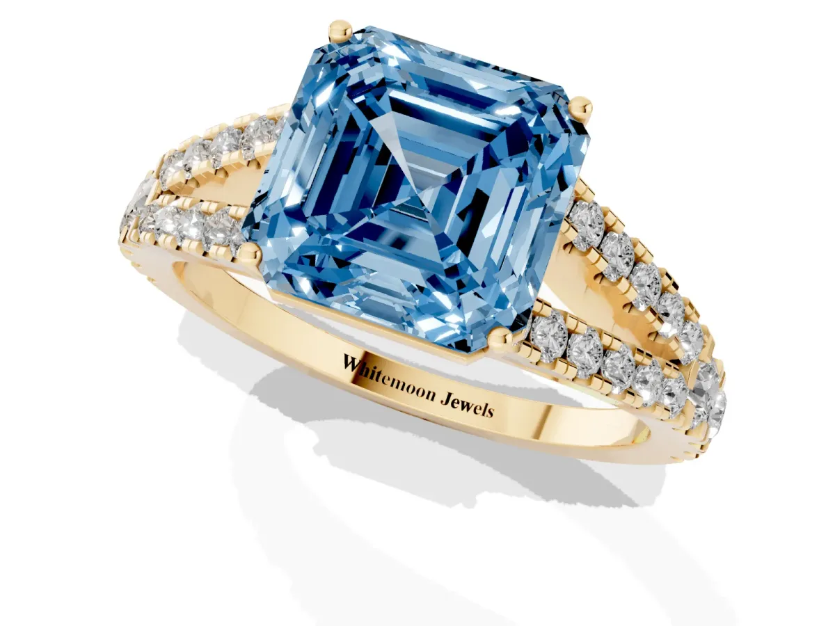 Fancy Blue Asscher Cut Diamond Split Shank Engagement Ring with Round Pavé and Prong Setting Yellow gold