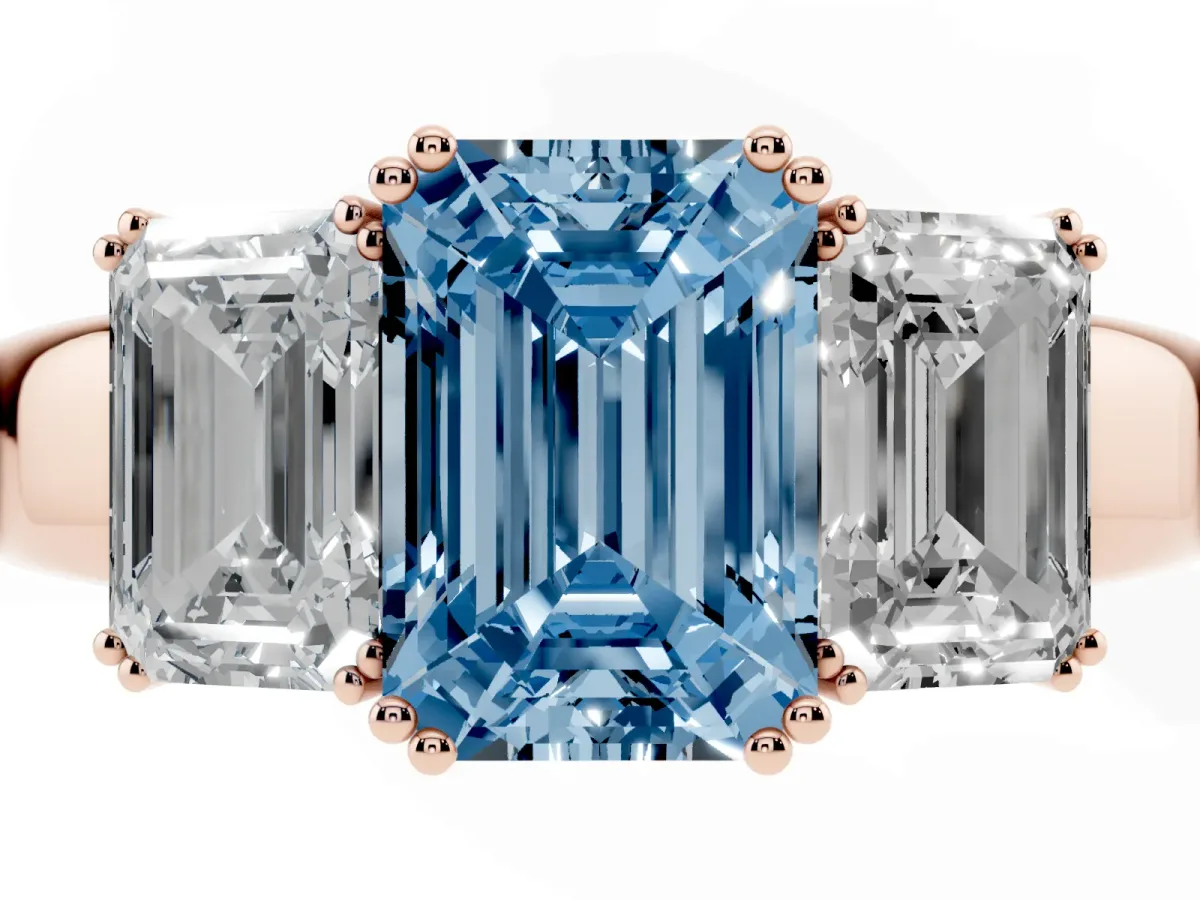 Fancy Blue Three-Stone Emerald Cut Cut Diamond Ring with Channel Set Band and Four-Prong Setting Rose gold